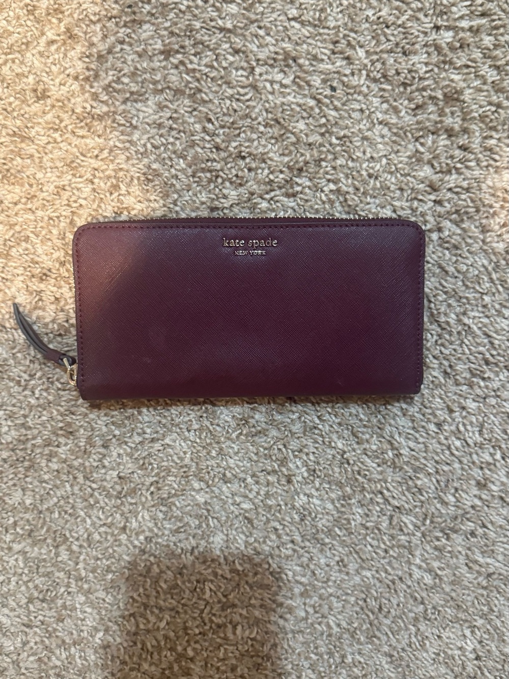 kate spade burgundy zip-around Saffiano wallet
